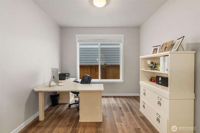 office area featuring baseboards and dark wood-style floors