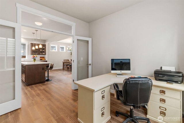 office space featuring light wood-style flooring