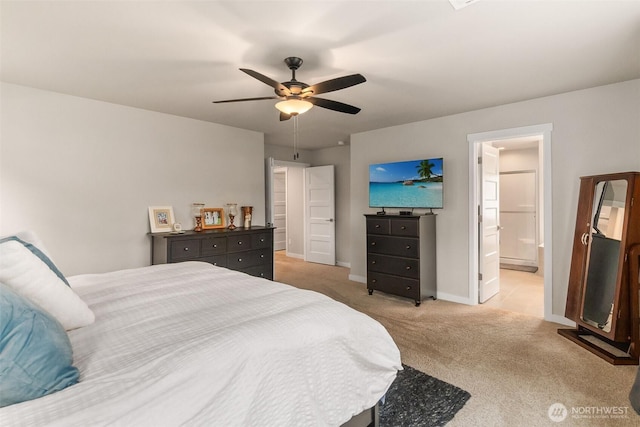 carpeted bedroom with baseboards, ensuite bath, and ceiling fan