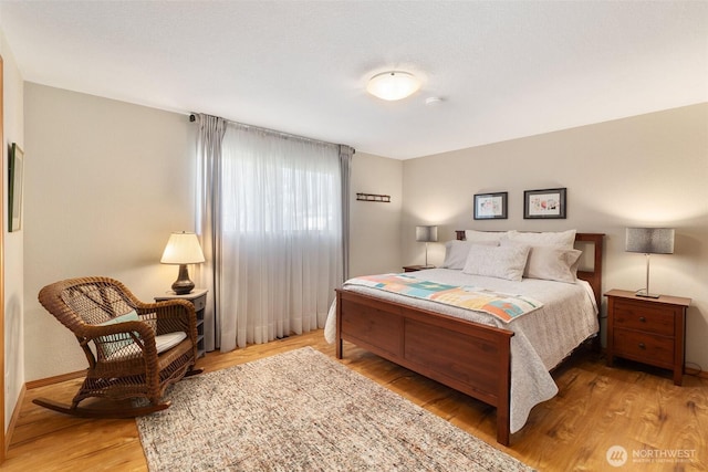 bedroom featuring wood finished floors