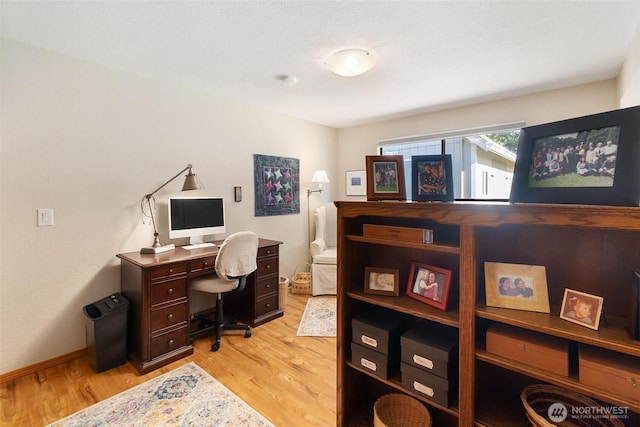 office with light wood finished floors and baseboards