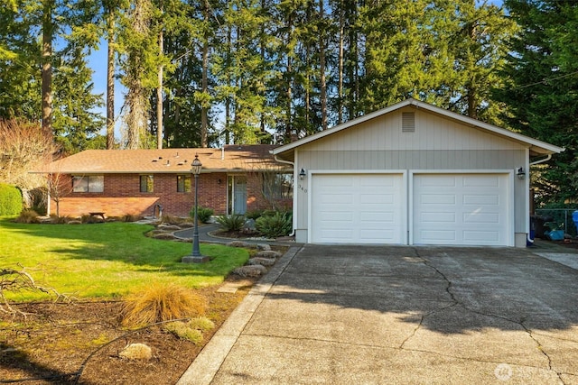 ranch-style home featuring brick siding, a garage, concrete driveway, and a front yard