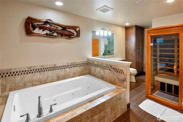 20417 Pugh Rd NE, Poulsbo, WA 98370 - full bath with toilet, a tub with jets, tile patterned floors, and recessed lighting