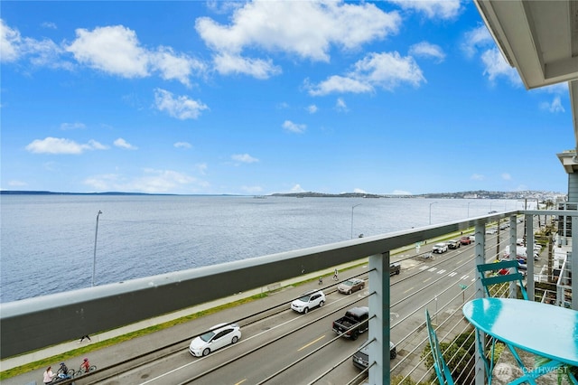 balcony featuring a water view