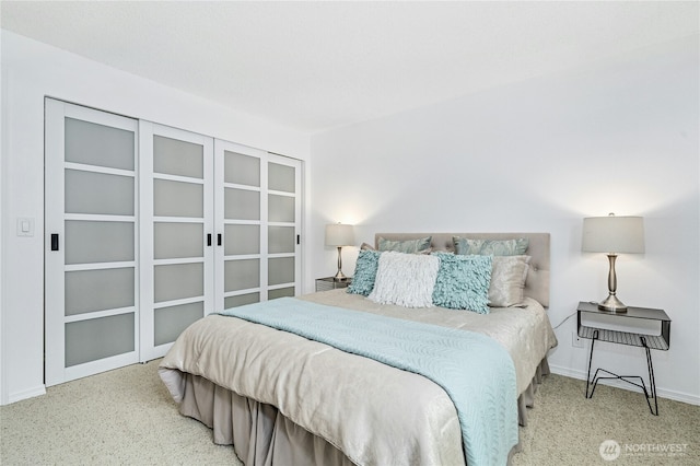 carpeted bedroom with baseboards