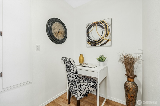 home office featuring baseboards and light wood-style flooring