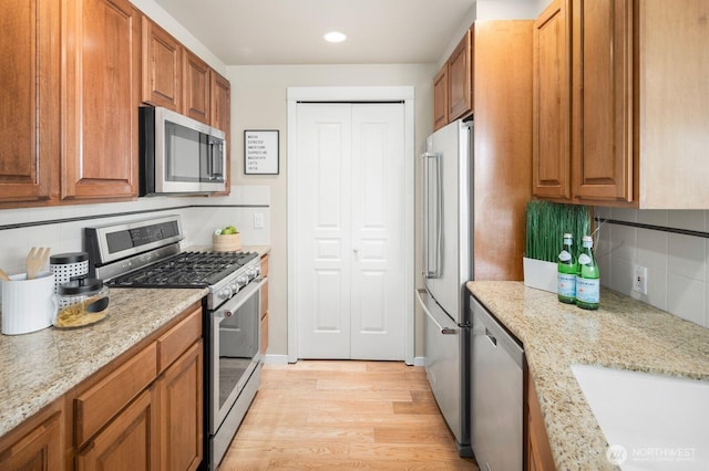 kitchen featuring brown cabinets and stainless steel appliances