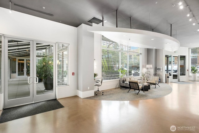 interior space featuring french doors, visible vents, and rail lighting