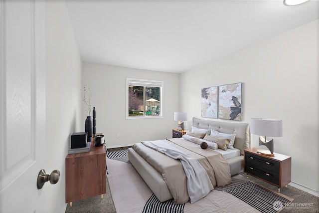 bedroom with carpet flooring and baseboards