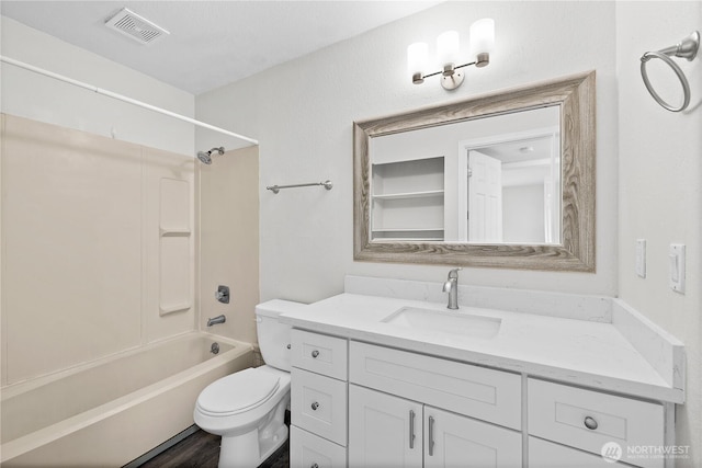 full bath with vanity, bathing tub / shower combination, toilet, and visible vents