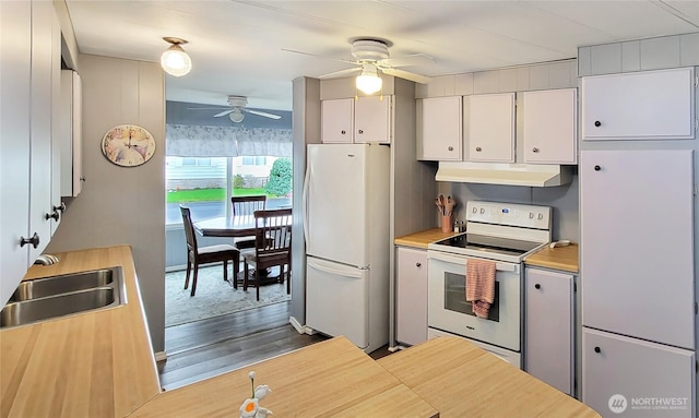 kitchen with under cabinet range hood, white appliances, white cabinetry, a ceiling fan, and a sink