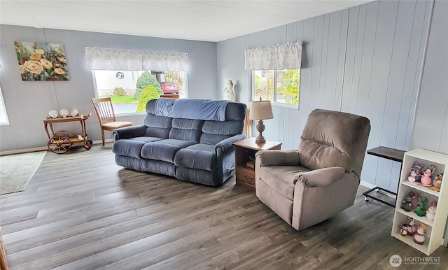 living area with wood finished floors and baseboards