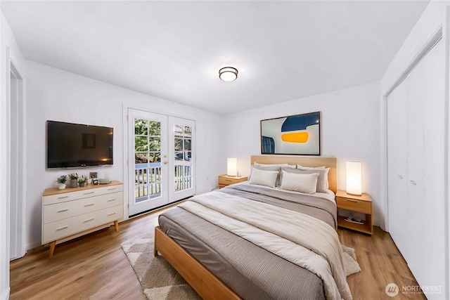 bedroom featuring light wood-type flooring and access to outside