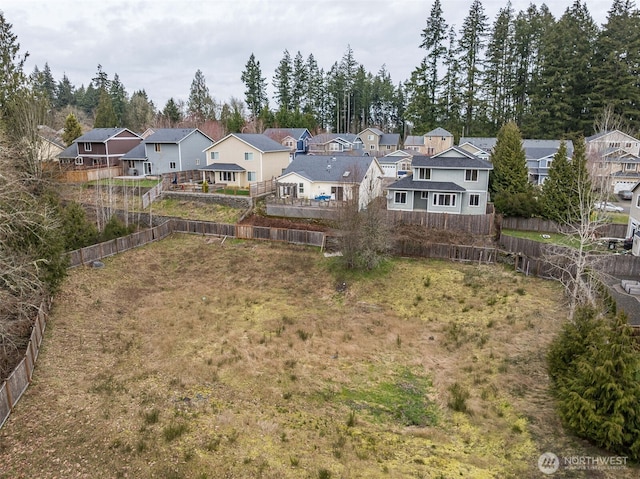 birds eye view of property with a residential view