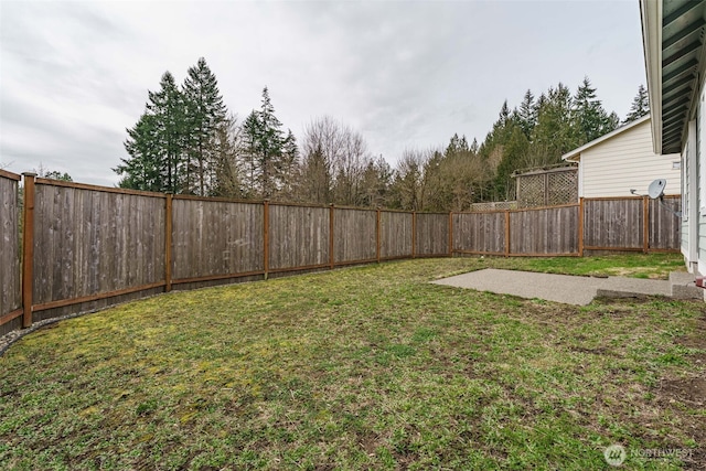 view of yard with a fenced backyard