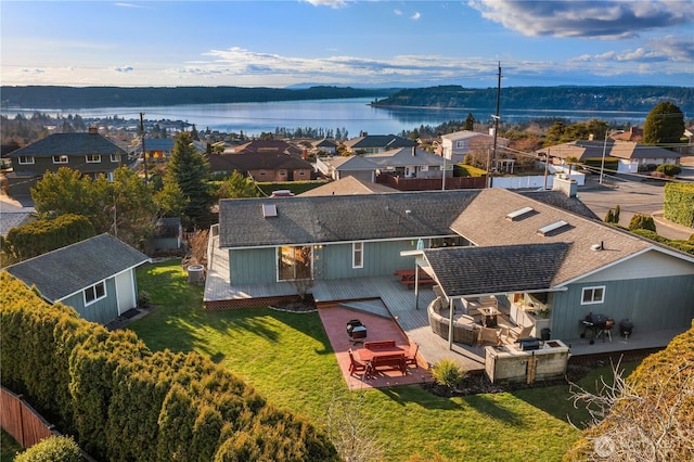 aerial view with a residential view and a water view