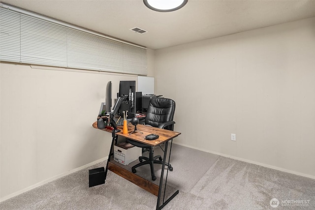 carpeted office featuring baseboards and visible vents