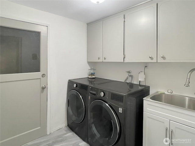 1507 S Jackson Ave, Tacoma, WA 98465 - clothes washing area with cabinet space and separate washer and dryer