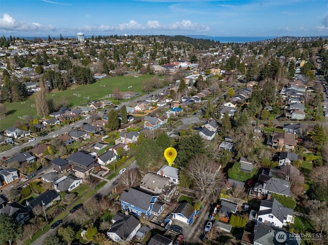 birds eye view of property with a residential view