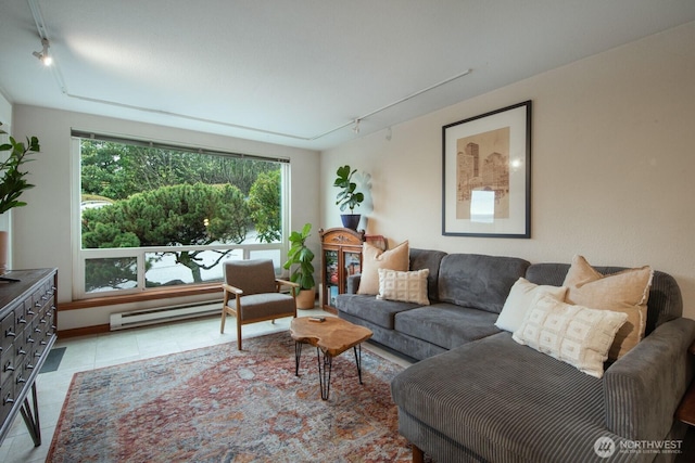 living room with rail lighting, light tile patterned floors, and baseboard heating