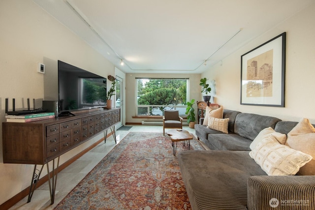 tiled living room with baseboard heating and track lighting