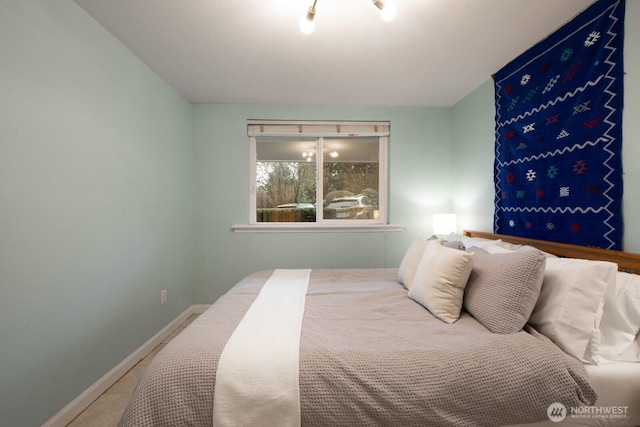 bedroom featuring baseboards