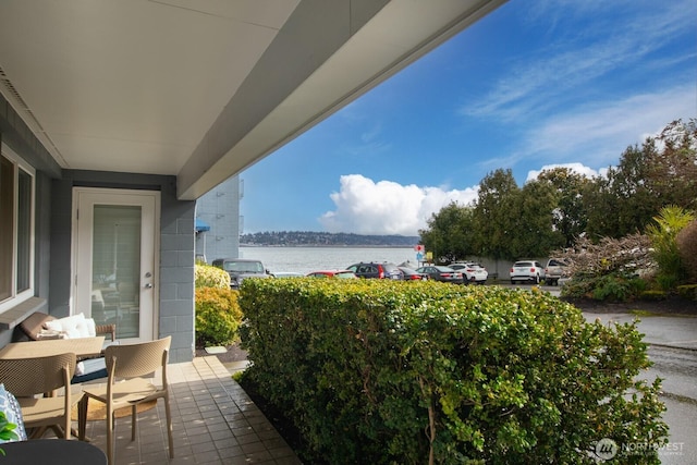 balcony featuring a water view