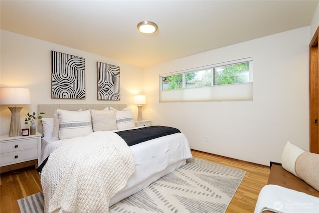 bedroom featuring wood finished floors