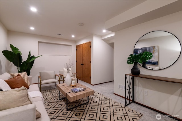 living room featuring recessed lighting, light colored carpet, baseboards, and visible vents