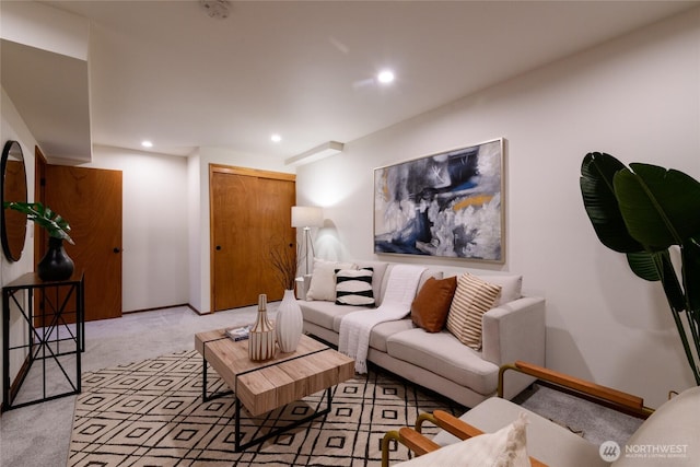 living area with recessed lighting, baseboards, and light carpet