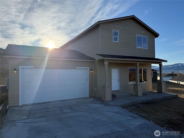 view of front of house with an attached garage and driveway