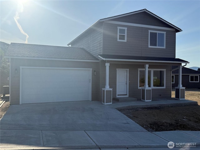 859 N Lyle Ave, East Wenatchee, WA 98802 - traditional home featuring a porch, driveway, and a garage