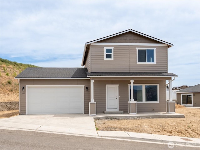 859 N Lyle Ave, East Wenatchee, WA 98802 - traditional-style house featuring a porch, driveway, a garage, and roof with shingles