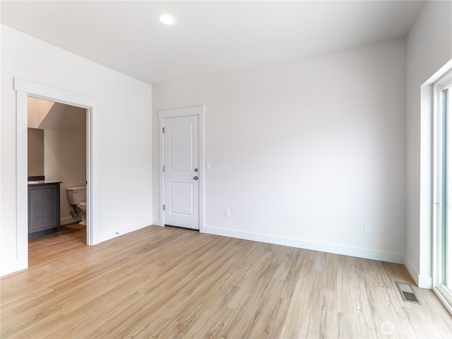 859 N Lyle Ave, East Wenatchee, WA 98802 - empty room with light wood finished floors and recessed lighting