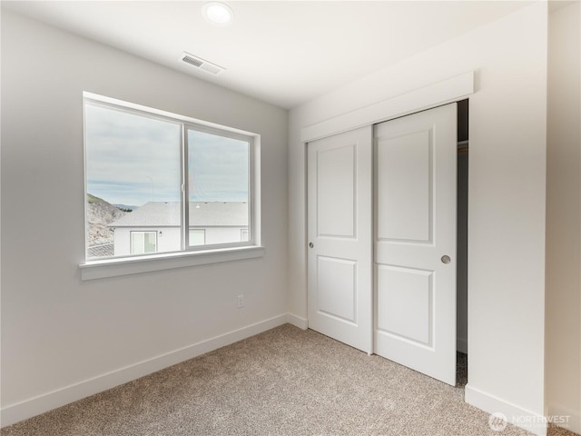 859 N Lyle Ave, East Wenatchee, WA 98802 - unfurnished bedroom with light colored carpet and a closet