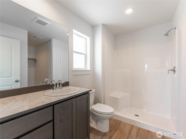 859 N Lyle Ave, East Wenatchee, WA 98802 - bathroom featuring wood finished floors, vanity, and a shower