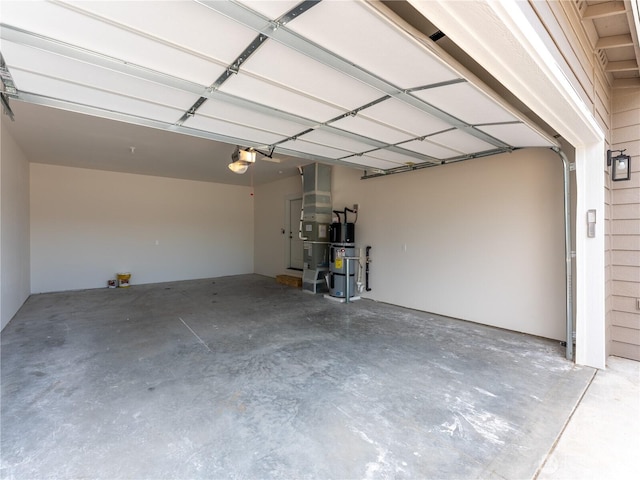 859 N Lyle Ave, East Wenatchee, WA 98802 - garage with secured water heater and a garage door opener
