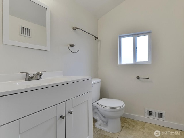 bathroom with vanity, toilet, visible vents, and tile patterned flooring