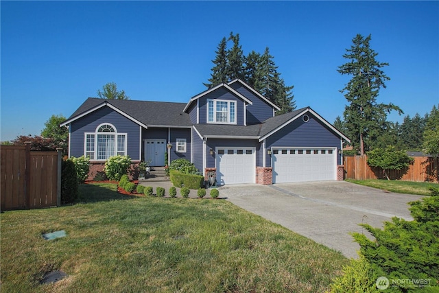 view of front facade with a front lawn, fence, brick siding, and driveway