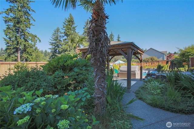 view of yard with a gazebo, a patio area, a fenced in pool, and a fenced backyard