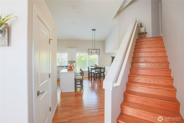 staircase with wood finished floors