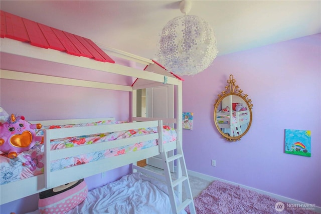 carpeted bedroom with baseboards