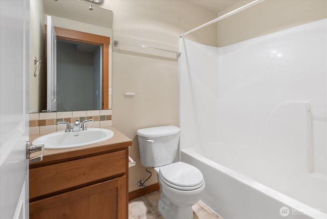 full bath featuring vanity, decorative backsplash, toilet, and shower / tub combination