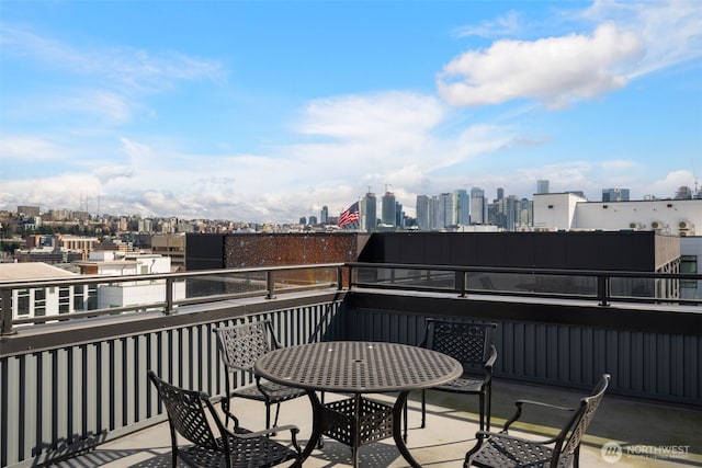 balcony featuring a city view