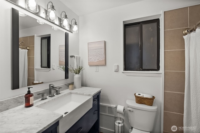 bathroom featuring visible vents, toilet, vanity, and a shower with shower curtain