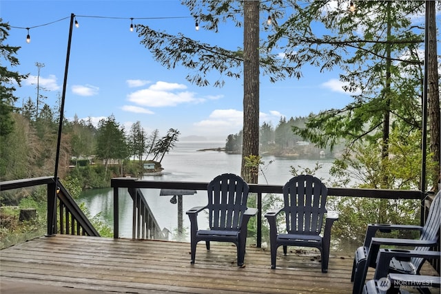 wooden terrace with a water view