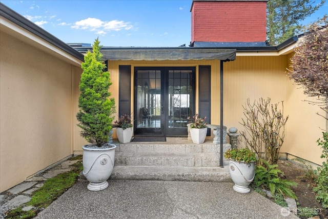 entrance to property featuring french doors