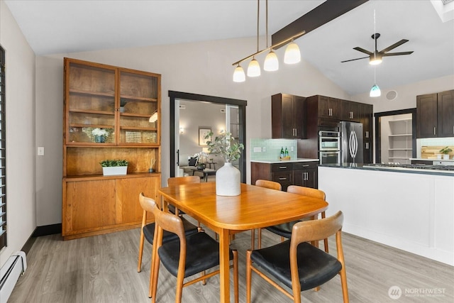 dining area with lofted ceiling with beams, light wood-style floors, baseboard heating, and ceiling fan