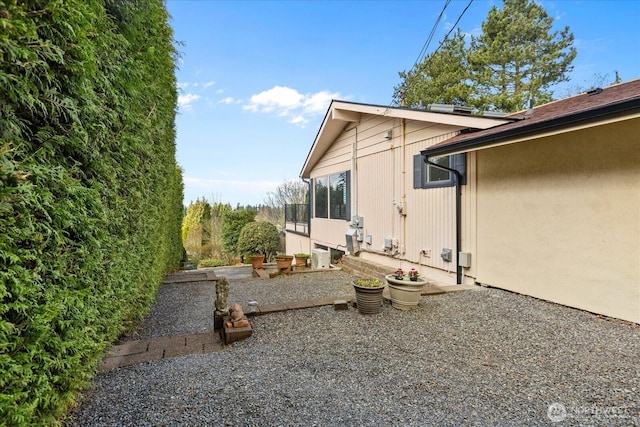 view of side of property with a patio