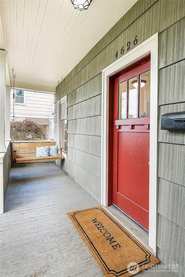 doorway to property with covered porch